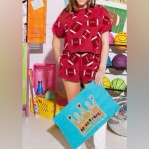 Queen of Sparkles Maroon Fuzzy Pearl Football shorts 
NWOT size M